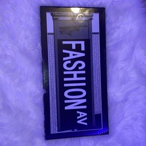 black & white “fashion ave” nyc sign